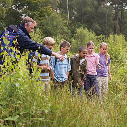 Teacher and pupils at nature reserve