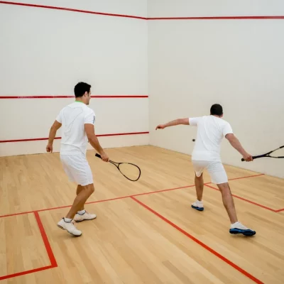 two people playing squash